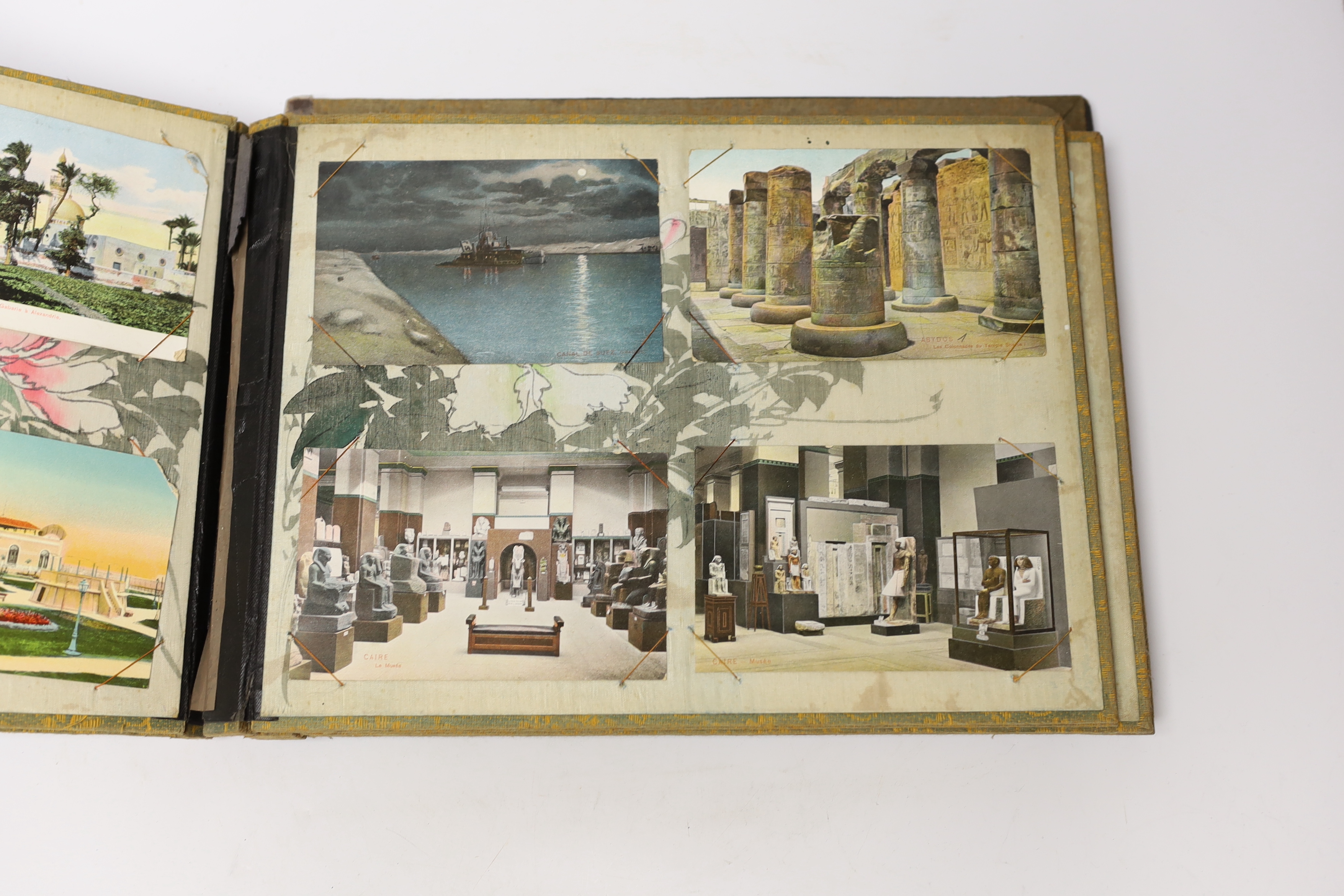 A Japanese bone and mother of pearl inlaid lacquer postcard album with continental postcards